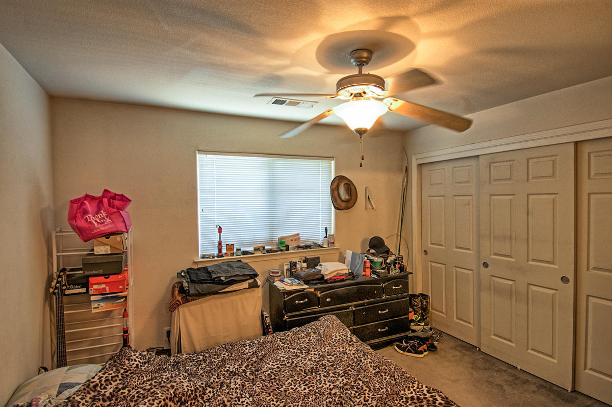 170 Gilmore Road Red Bluff, CA 96080 - Photo 23 of 33 a room with furniture and a chandelier