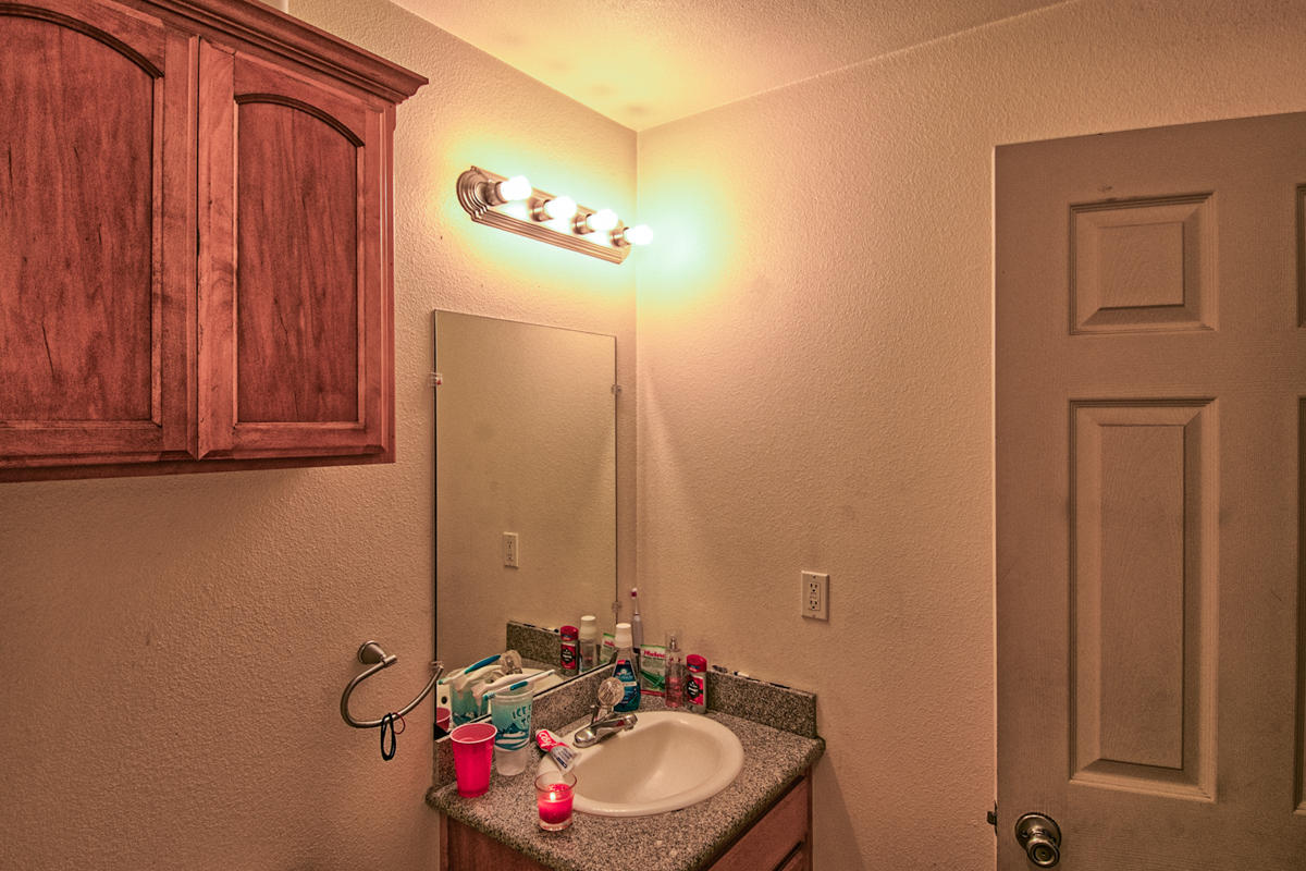 170 Gilmore Road Red Bluff, CA 96080 - Photo 25 of 33 a bathroom with a sink mirror and vanity