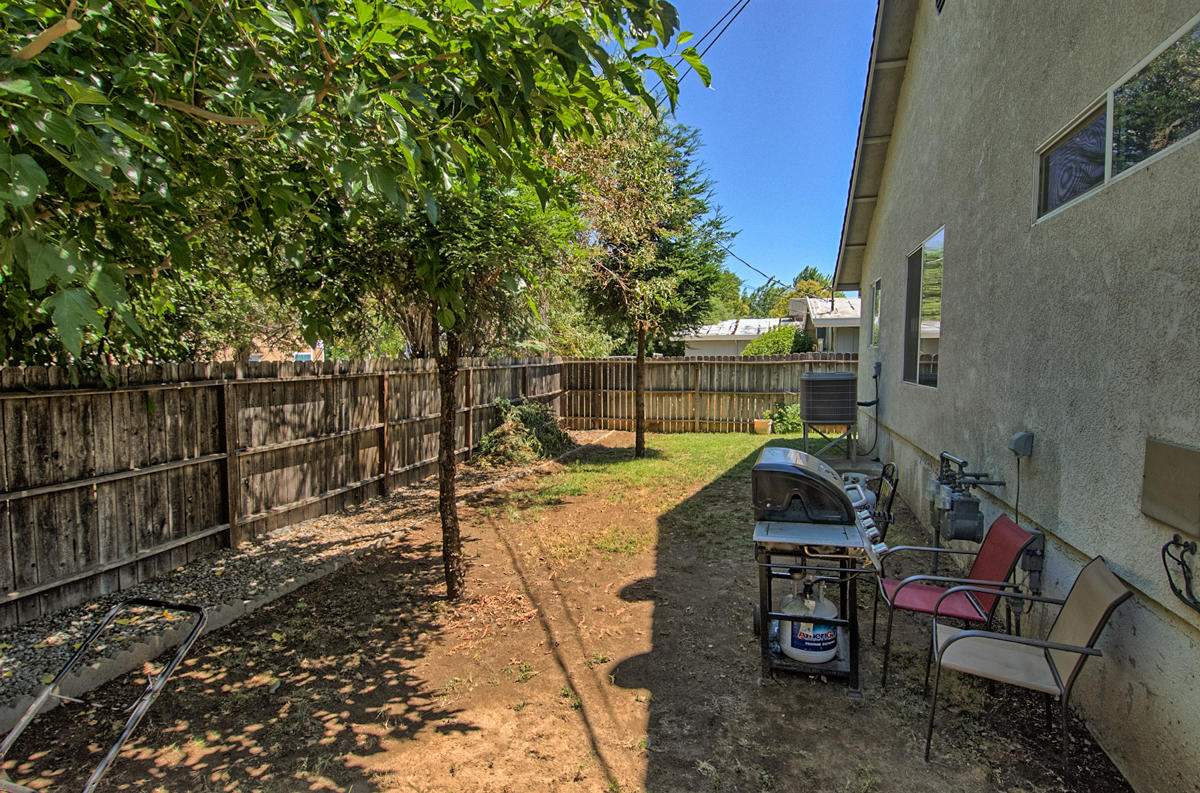 170 Gilmore Road Red Bluff, CA 96080 - Photo 33 of 33 a view of a patio with table and chairs and potted plants