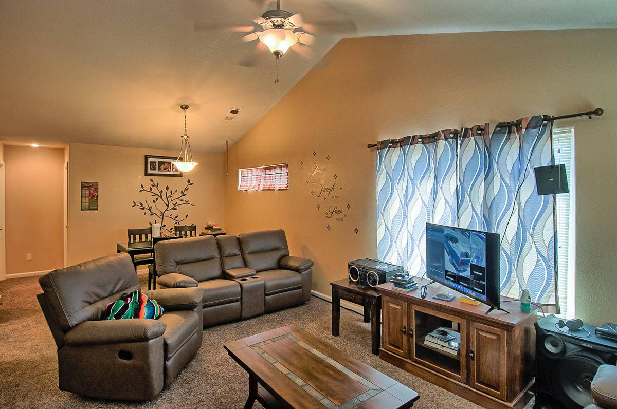 170 Gilmore Road Red Bluff, CA 96080 - Photo 6 of 33 a living room with furniture and a fireplace