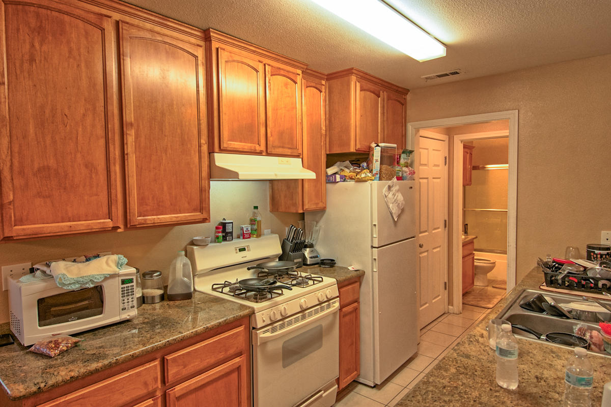 170 Gilmore Road Red Bluff, CA 96080 - Photo 10 of 33 a kitchen with a refrigerator stove and cabinets