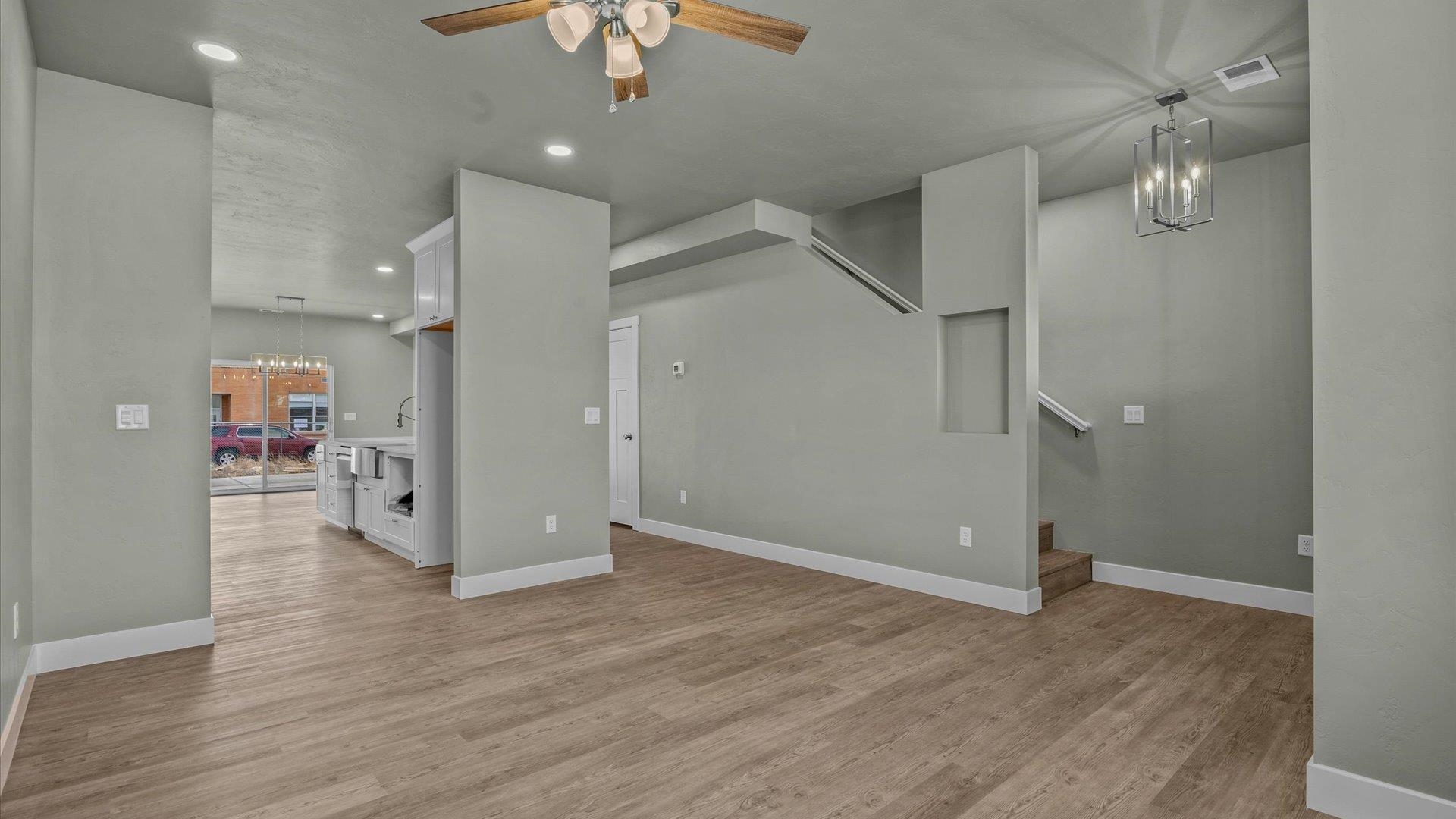579 Fledgefield Drive Grand Junction, CO 81504 - Photo 11 of 30 an empty room with wooden floor and ceiling fan