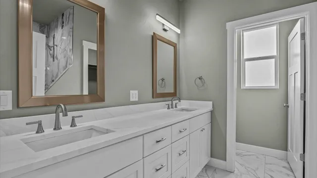 a bathroom with a shower and a sink