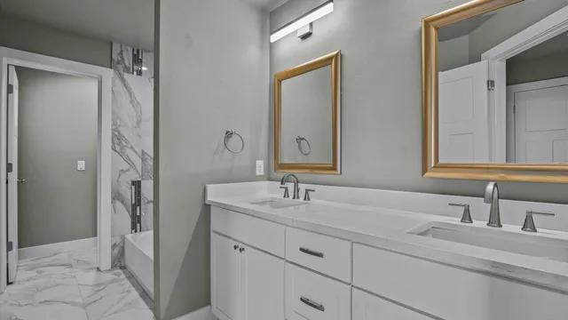 a bathroom with a shower vanity and a sink