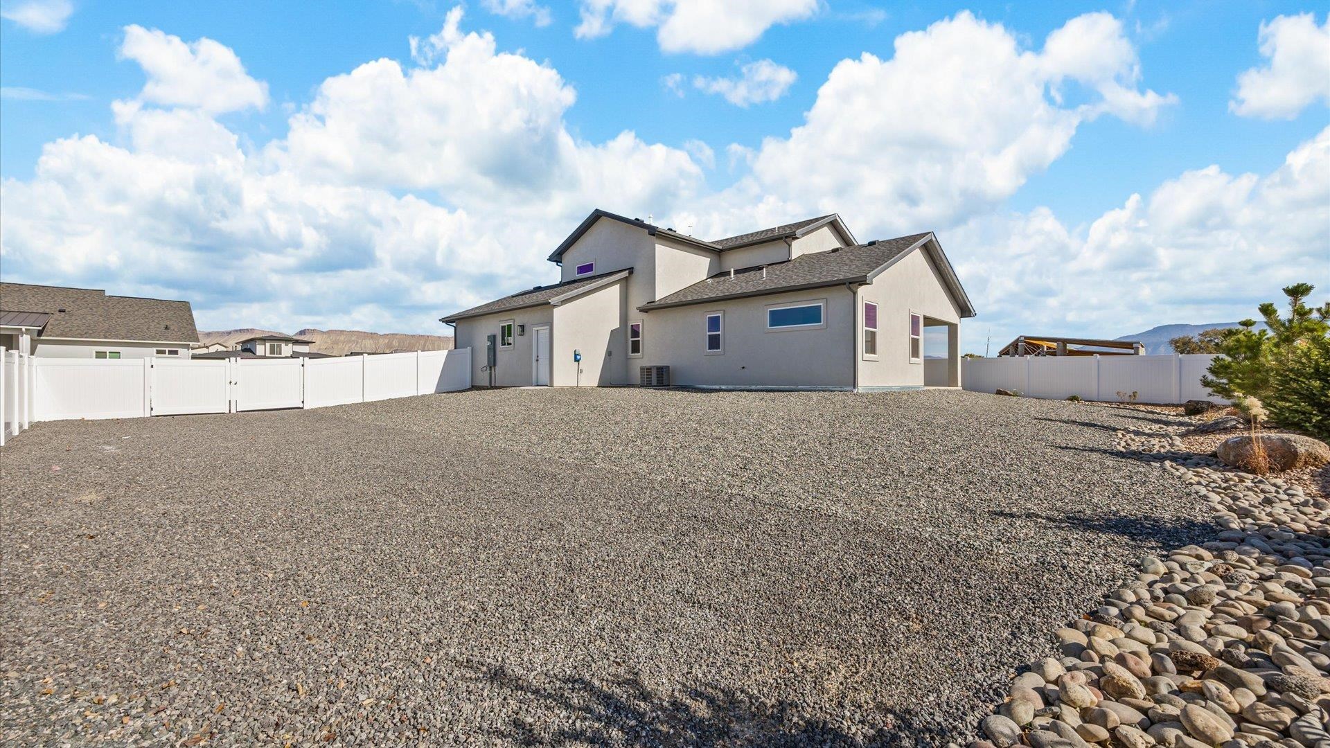 579 Fledgefield Drive Grand Junction, CO 81504 - Photo 5 of 30 a view of a house with a dry yard and covered with snow
