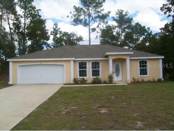 front view of a house with a yard