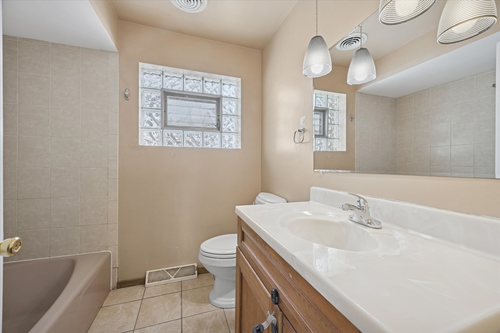 6718 41st Street Stickney, IL 60402 - Photo 4 of 15 a bathroom with a sink a toilet and bathtub