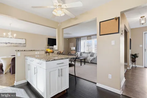 a view of living room with granite countertop furniture and a fireplace
