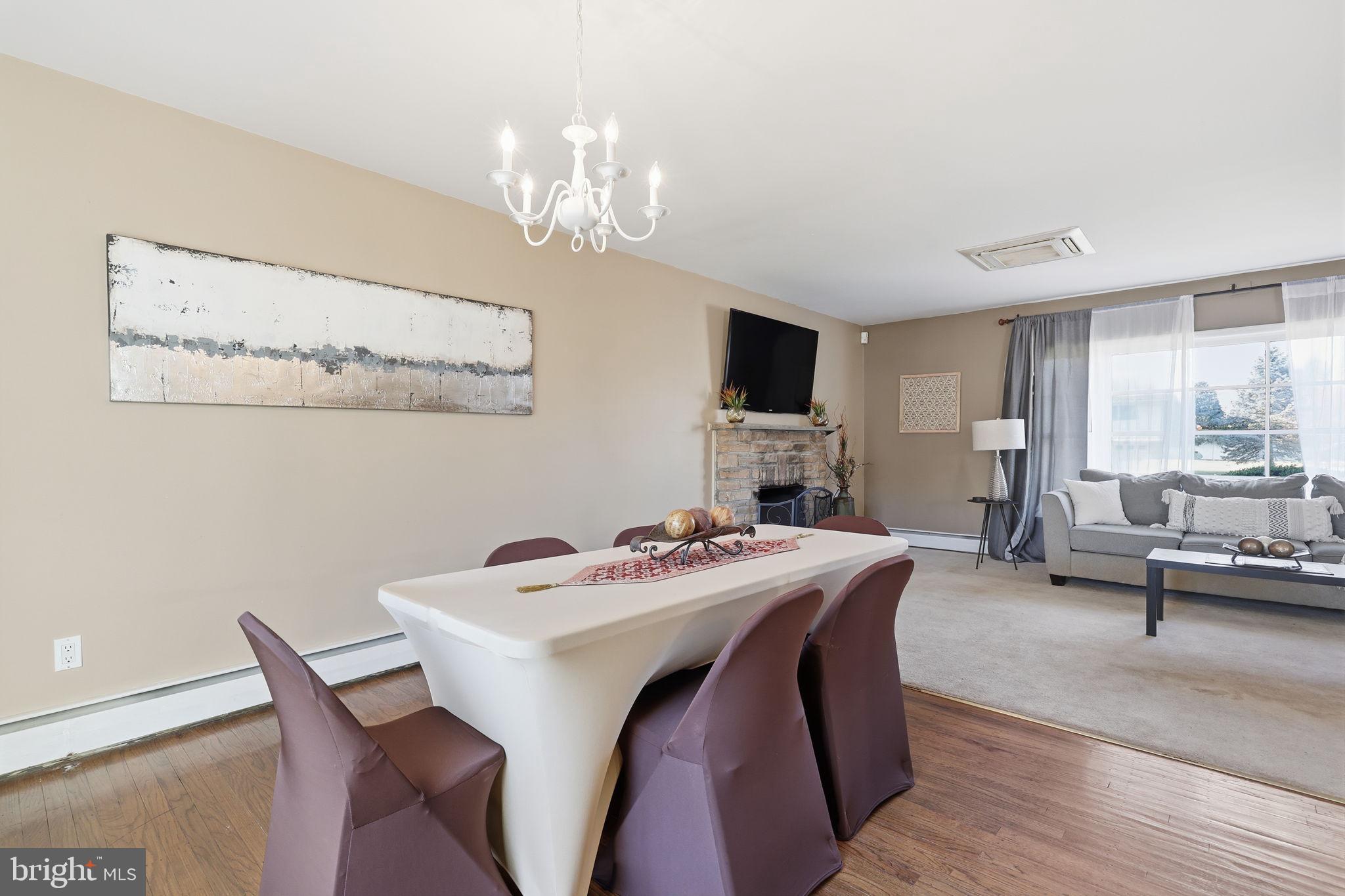 5 Patrick Lane Yardley, PA 19067 - Photo 20 of 51 a view of a dining room with furniture a chandelier and wooden floor
