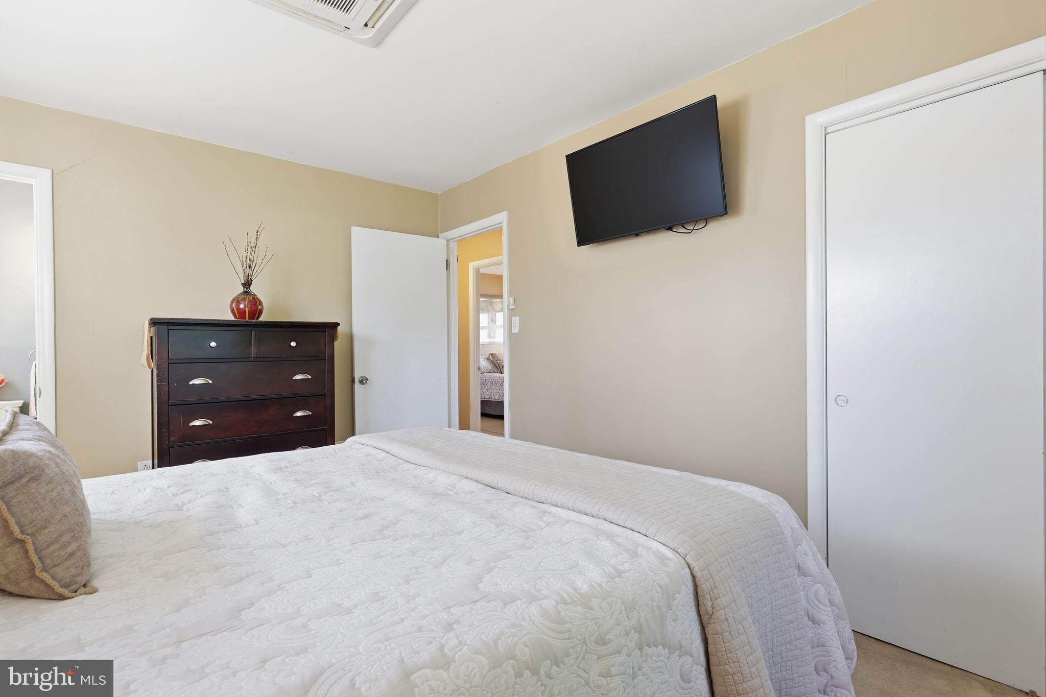 5 Patrick Lane Yardley, PA 19067 - Photo 23 of 51 a bedroom with a bed and a flat screen tv