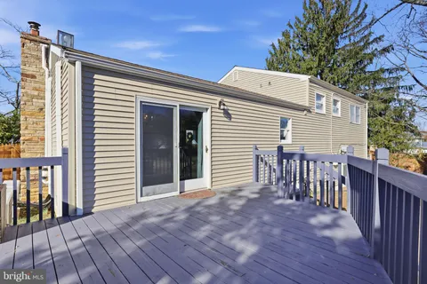 a view of a house with wooden deck