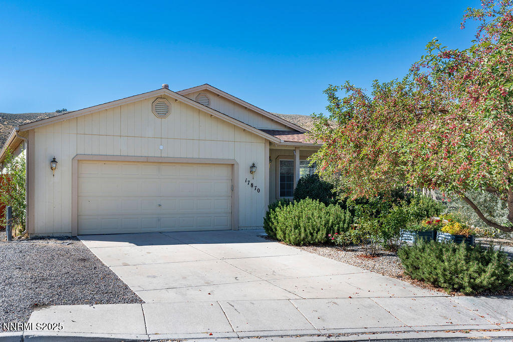 17870 Fairfax Court Reno, NV 89508 - Photo 1 of 23 a front view of a house with a yard and garage