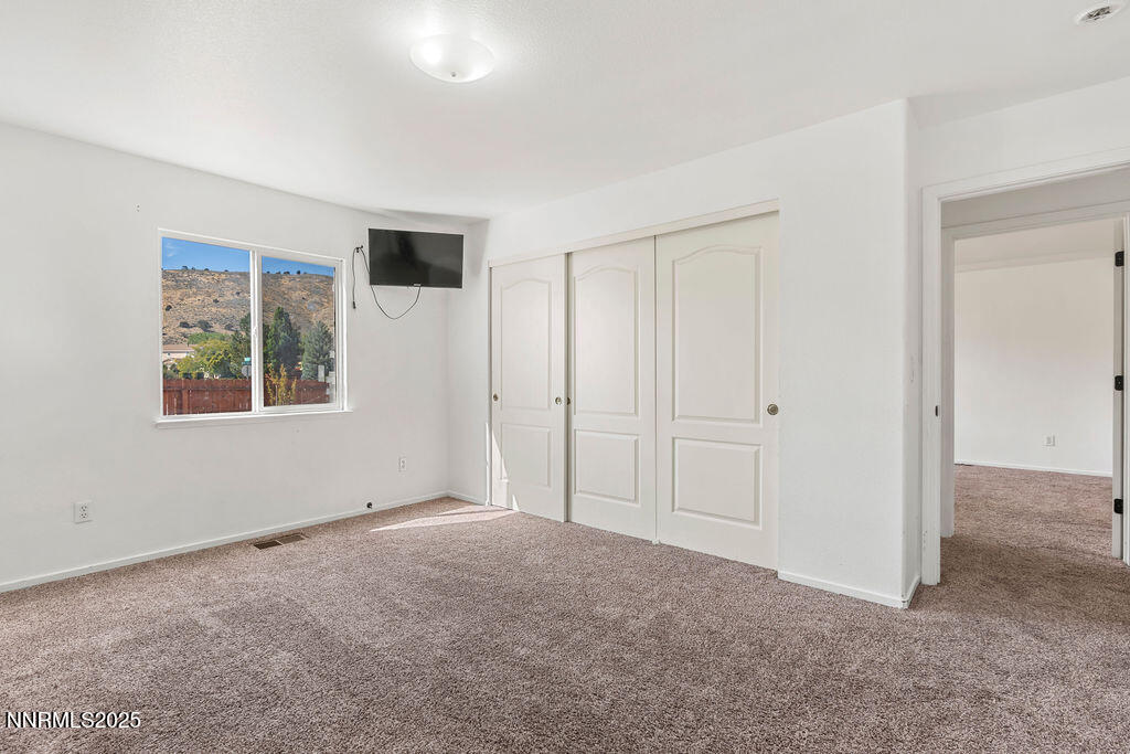 17870 Fairfax Court Reno, NV 89508 - Photo 11 of 23 a view of an empty room with a window