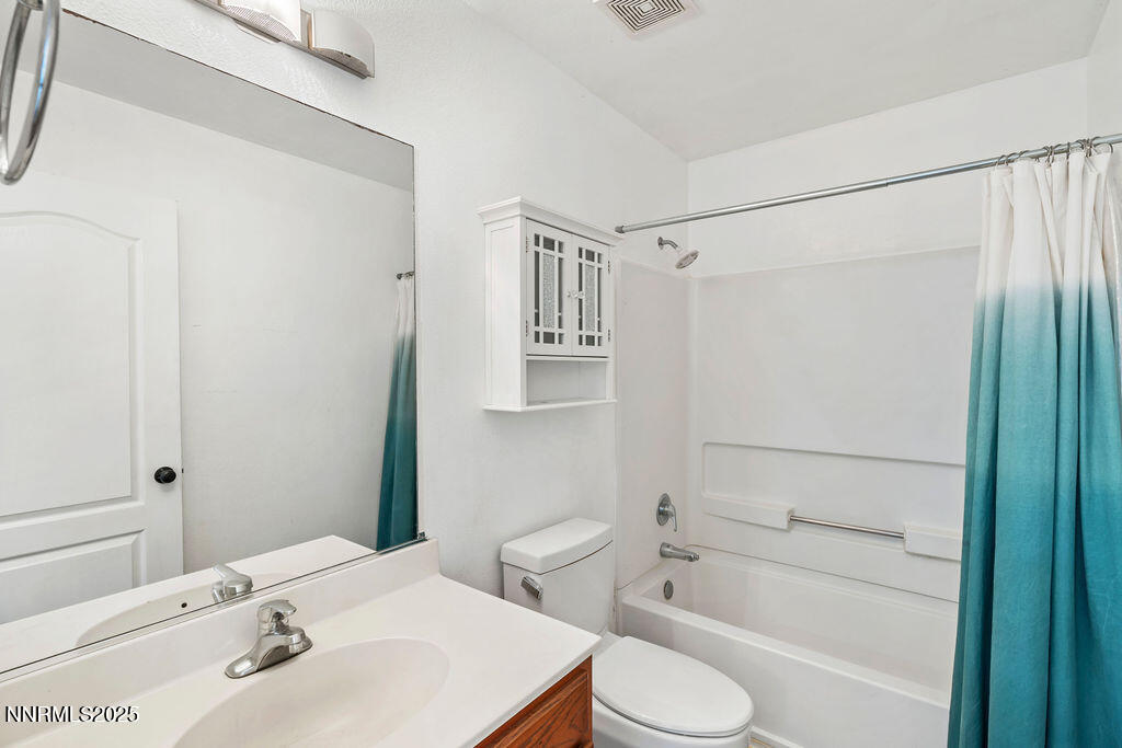 17870 Fairfax Court Reno, NV 89508 - Photo 14 of 23 a bathroom with a sink toilet and shower