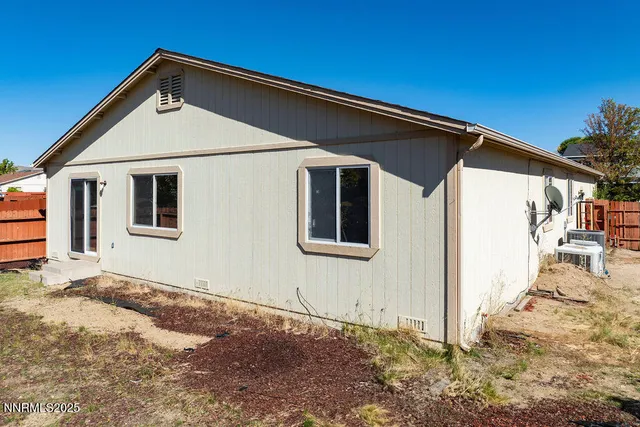 a house with trees in the background
