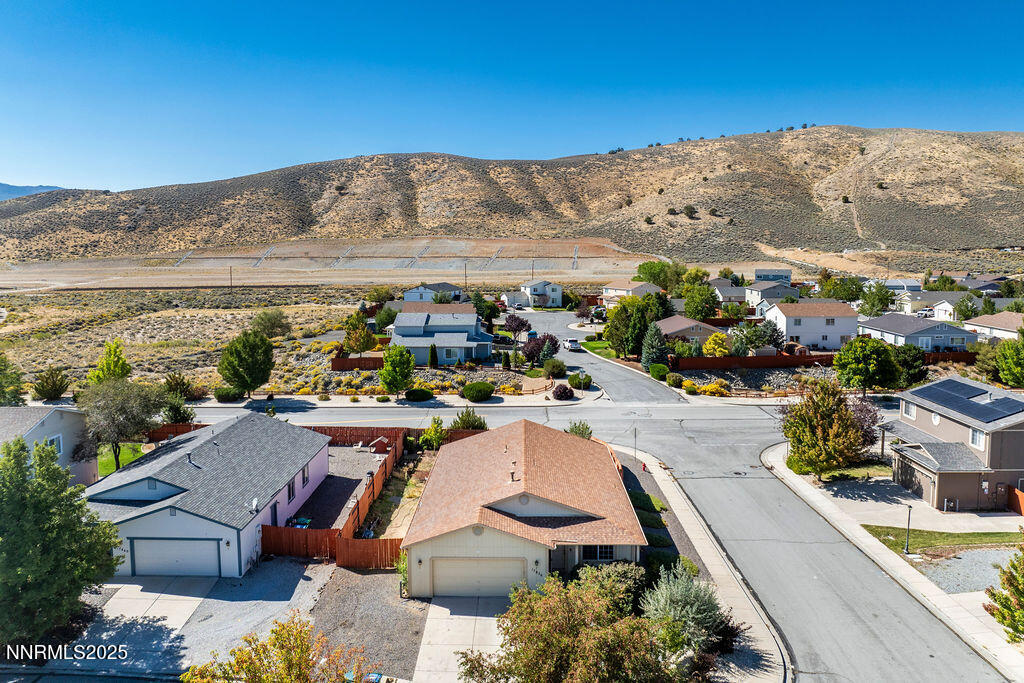 17870 Fairfax Court Reno, NV 89508 - Photo 2 of 23 a view of a swimming pool with a table and chairs