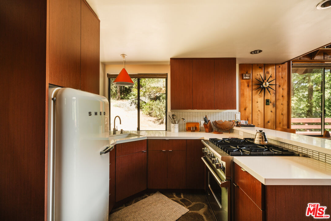 26955 Meadow Glen Drive Idyllwild, CA 92549 - Photo 11 of 57 a kitchen with a sink stove and refrigerator