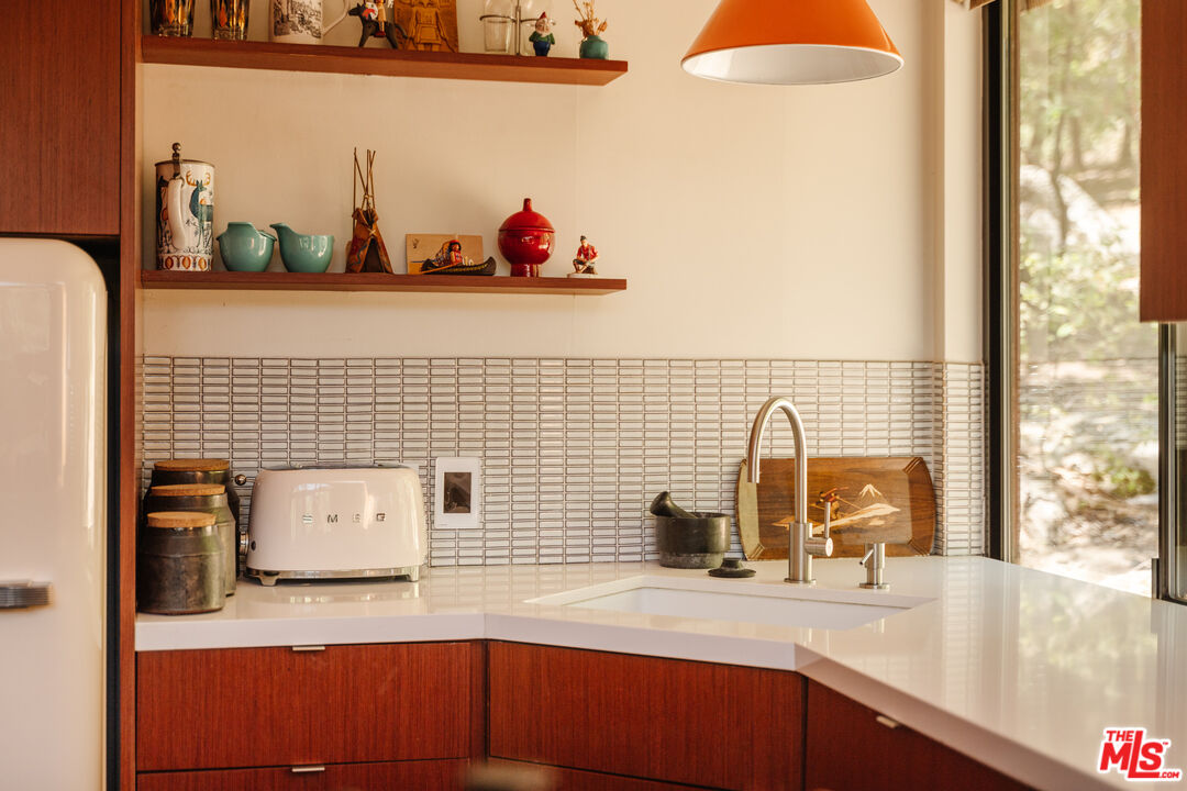 26955 Meadow Glen Drive Idyllwild, CA 92549 - Photo 12 of 57 a bathroom with a sink a mirror and next to a window