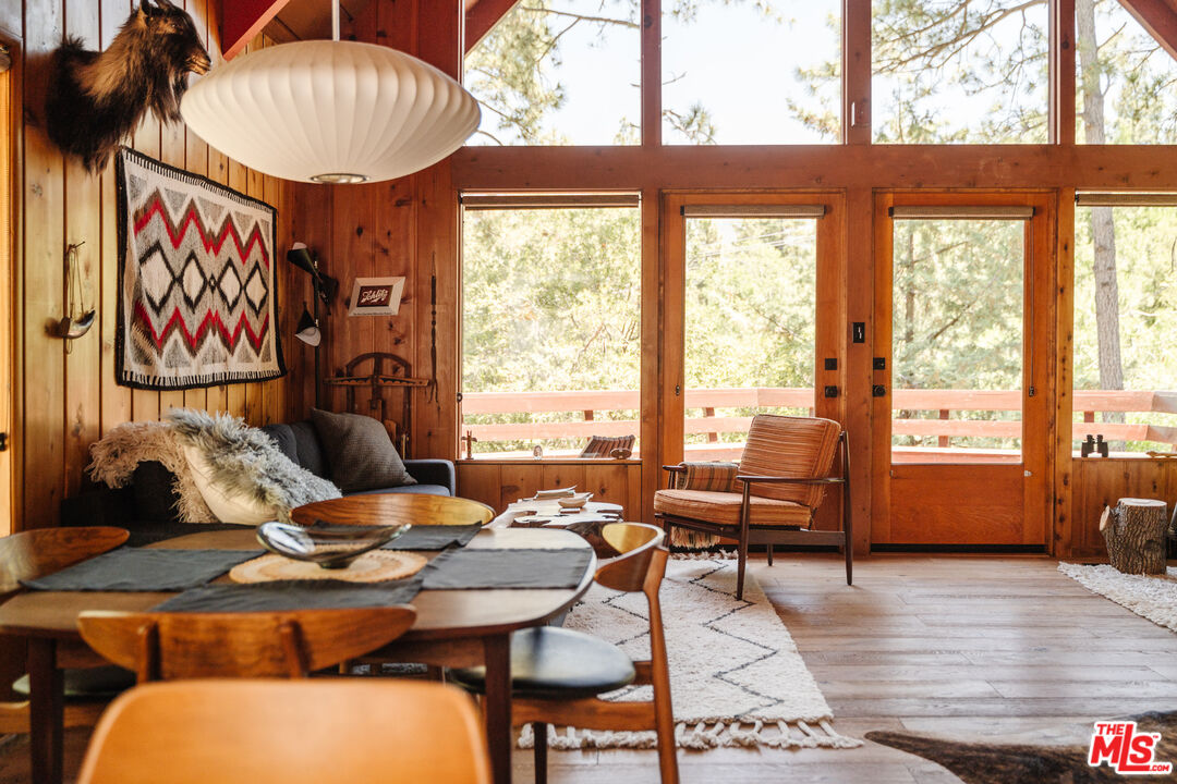26955 Meadow Glen Drive Idyllwild, CA 92549 - Photo 15 of 57 a living room with furniture and floor to ceiling windows