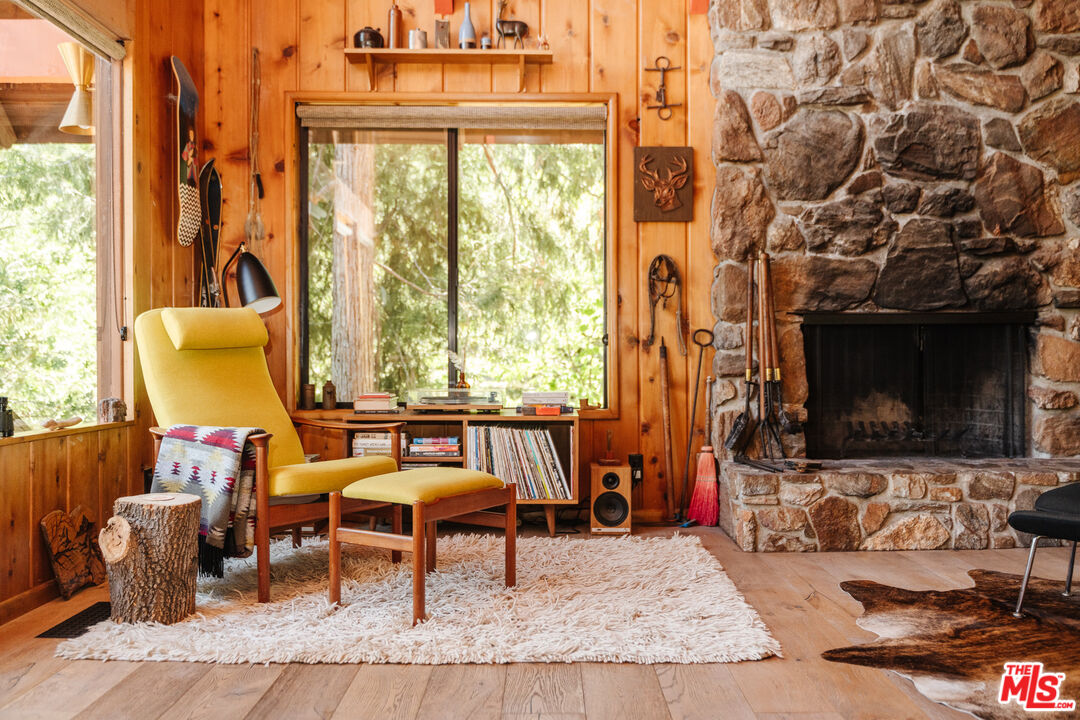 26955 Meadow Glen Drive Idyllwild, CA 92549 - Photo 17 of 57 a living room with fireplace furniture and a flat screen tv
