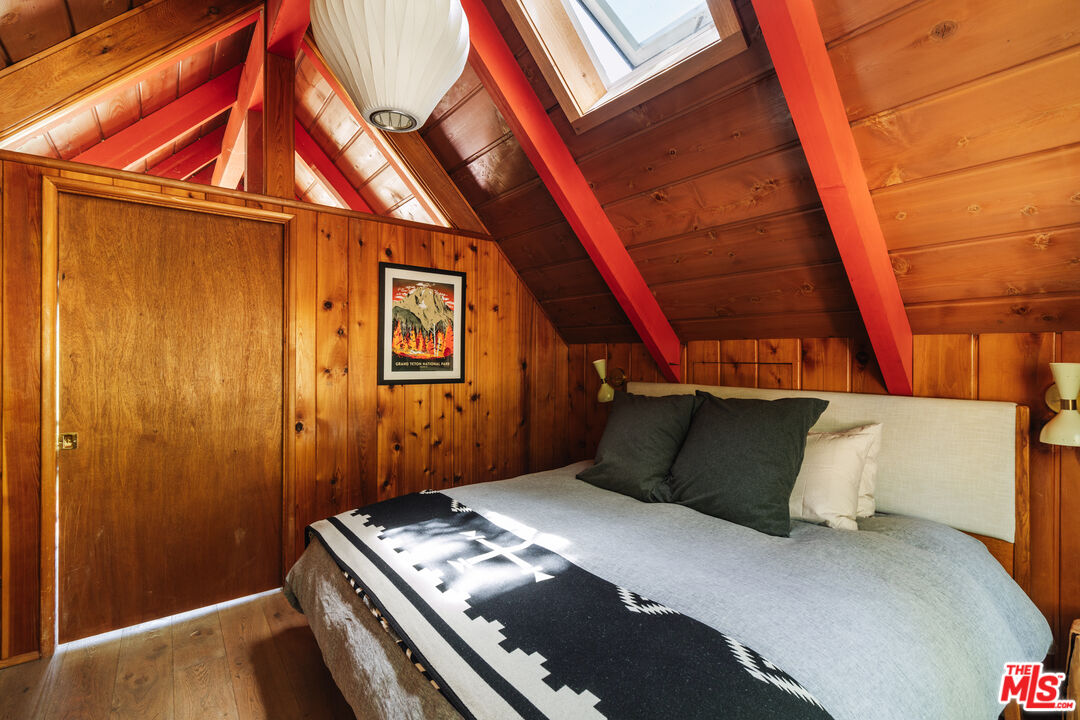 26955 Meadow Glen Drive Idyllwild, CA 92549 - Photo 22 of 57 a bedroom with a bed and wooden floor