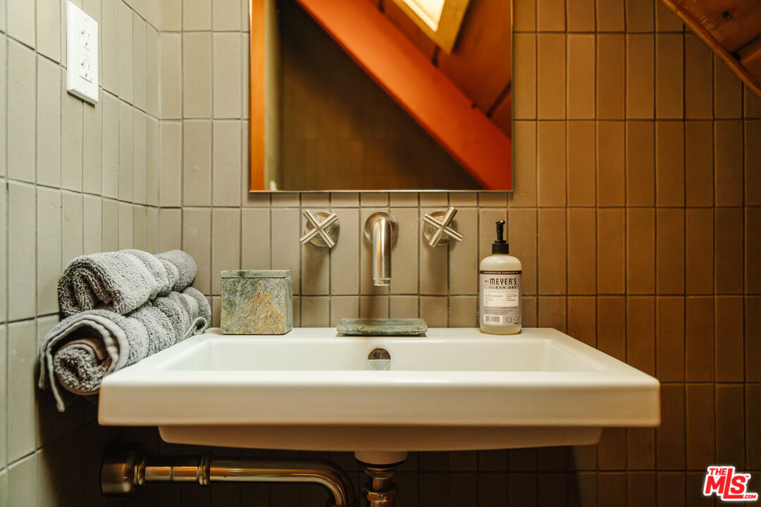 26955 Meadow Glen Drive Idyllwild, CA 92549 - Photo 25 of 57 a bathroom with a sink and a mirror
