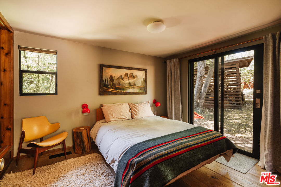 26955 Meadow Glen Drive Idyllwild, CA 92549 - Photo 27 of 57 a bedroom with a bed and a large window