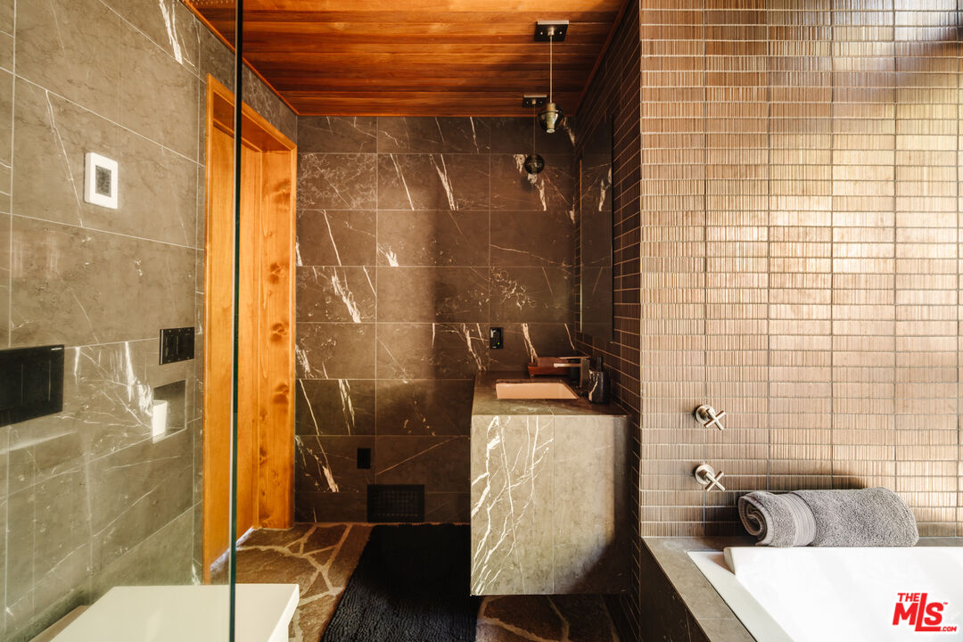 26955 Meadow Glen Drive Idyllwild, CA 92549 - Photo 30 of 57 a bathroom with a sink and mirror