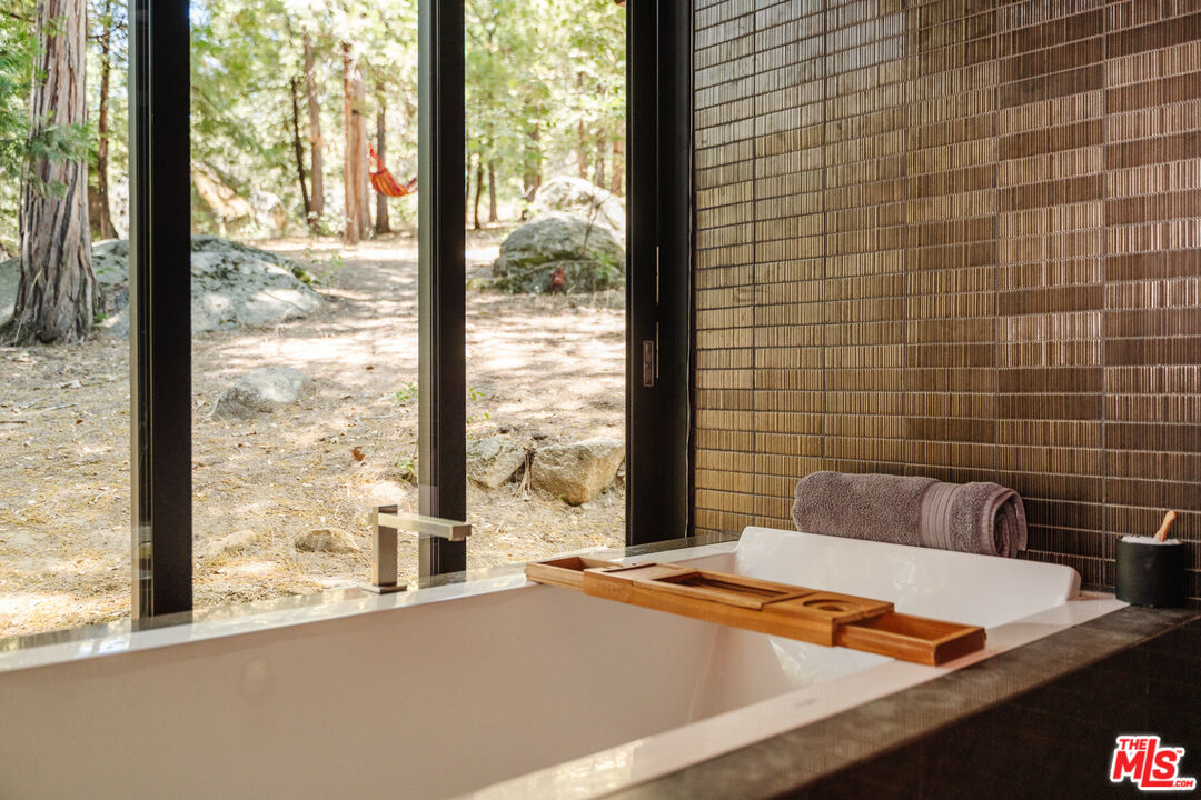 26955 Meadow Glen Drive Idyllwild, CA 92549 - Photo 32 of 57 a view of a bathroom with a sink and bathtub