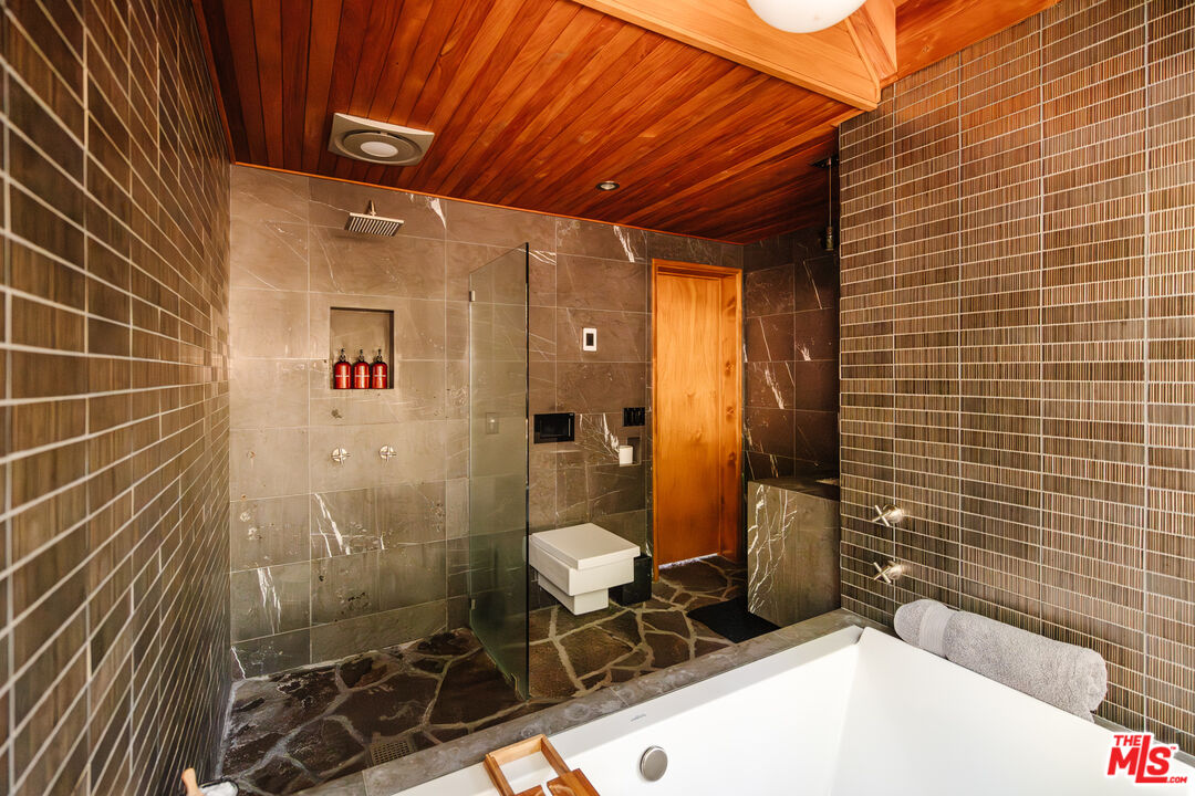 26955 Meadow Glen Drive Idyllwild, CA 92549 - Photo 33 of 57 a bathroom with a toilet and shower