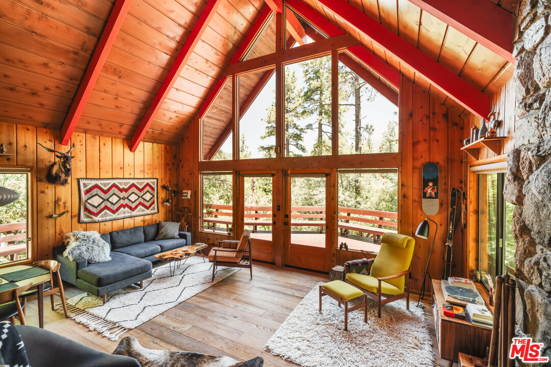26955 Meadow Glen Drive Idyllwild, CA 92549 - Photo 4 of 57 a living room with furniture and a floor to ceiling window