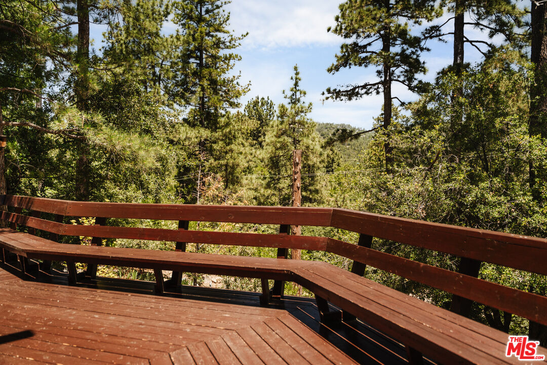 26955 Meadow Glen Drive Idyllwild, CA 92549 - Photo 48 of 57 a view of a wooden bench sitting in front of a building