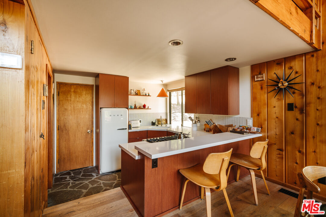 26955 Meadow Glen Drive Idyllwild, CA 92549 - Photo 10 of 57 a kitchen with stainless steel appliances a stove a refrigerator and cabinets