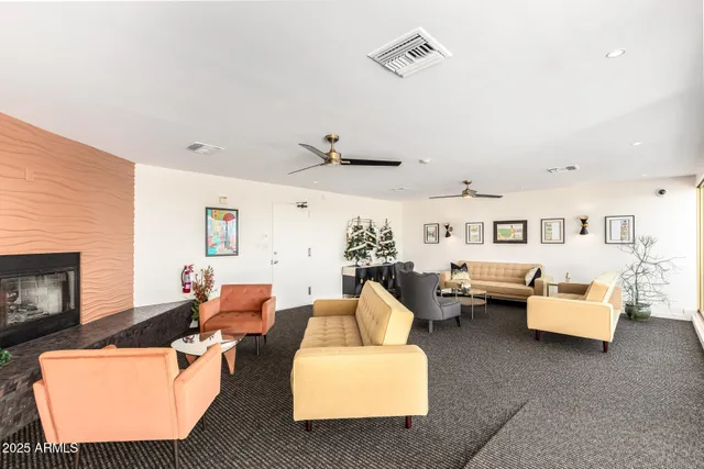a living room with furniture and a fireplace
