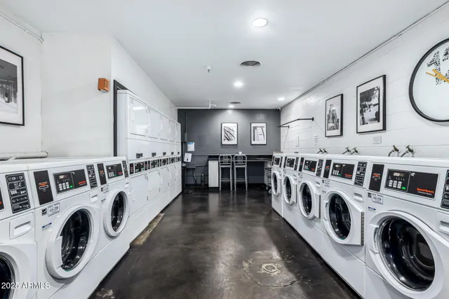 a view of a storage & utility room with dryer and washer