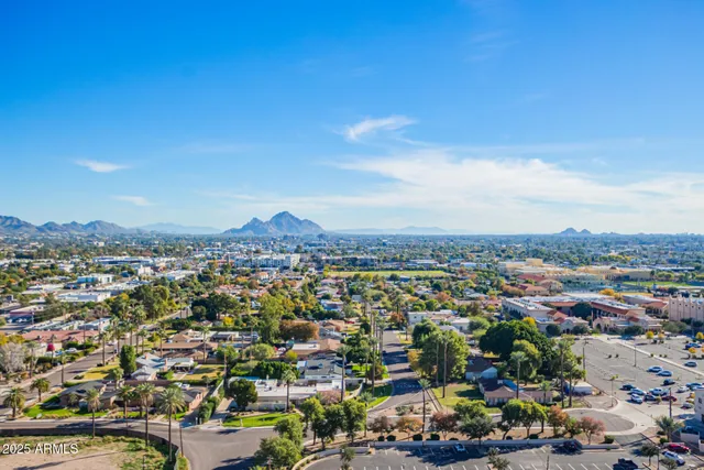 a view of a city with mountains in the background