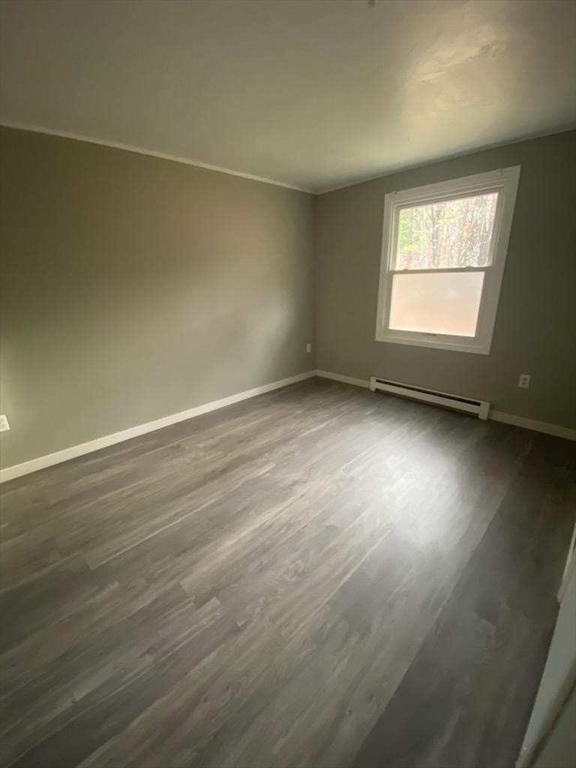 270 Sunderland Road, Unit 37 Worcester, MA 01604 - Photo 9 of 17 an empty room with wooden floor and windows