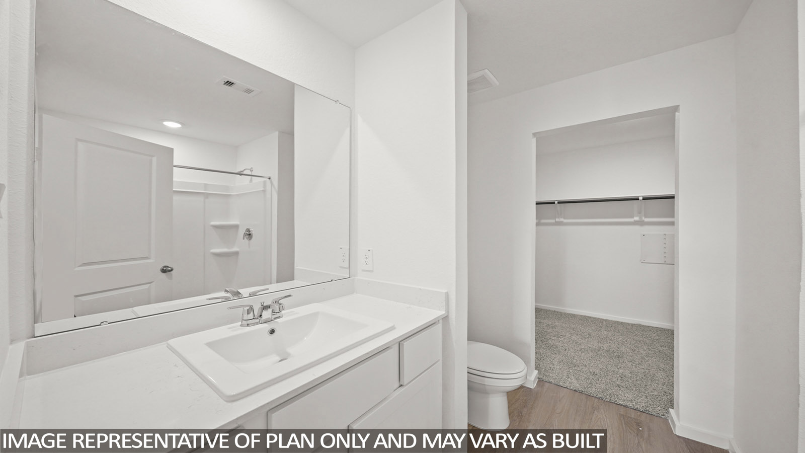 176 Baby Calf Roping Road Jarrell, TX 76537 - Photo 13 of 23 Bathroom featuring vanity, light wood-style floors, a shower, and a spacious closet