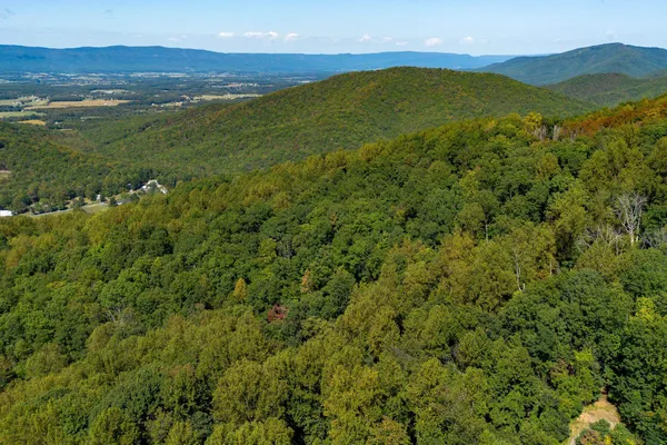 a view of an ocean and a mountain