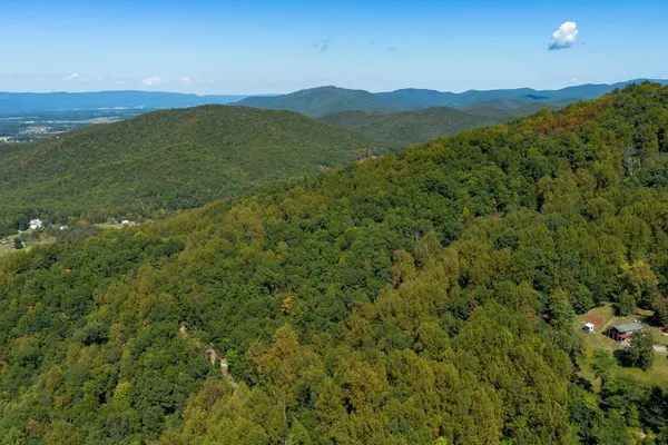 a view of a field with an ocean