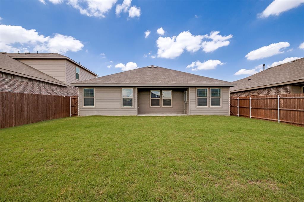621 Spaulding Street Justin, TX 76247 - Photo 22 of 22 a view of a house with a backyard