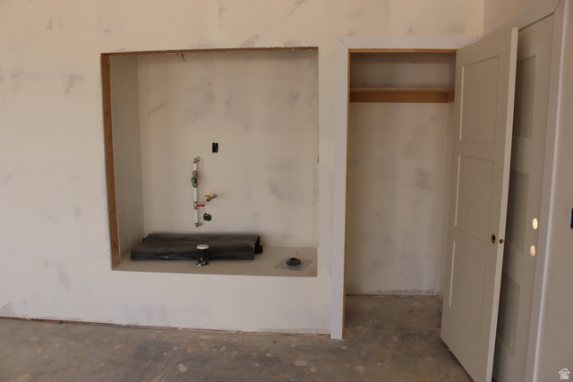 4933 East Remington Road Cedar City, UT 84721 - Photo 5 of 33 Recessed utility area with plumbing rough-ins and an adjacent closet featuring a wood shelf