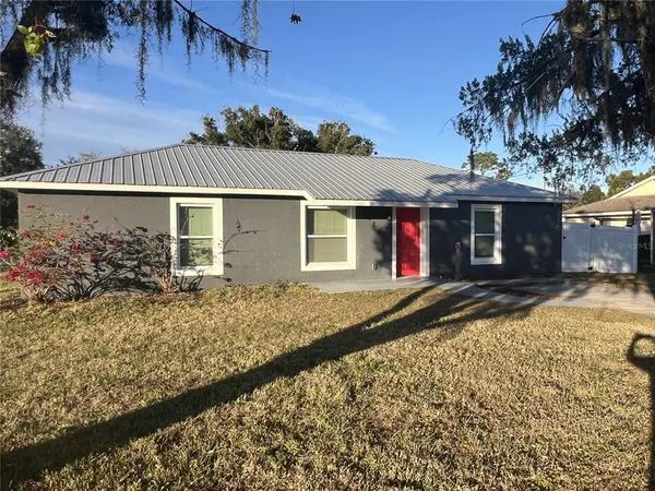 front view of a house with a yard