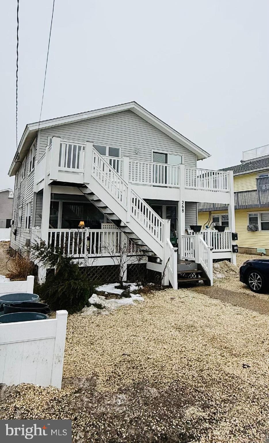268 14th Street Surf City, NJ 08008 - Photo 1 of 1 a view of a house with cars parked in front of house