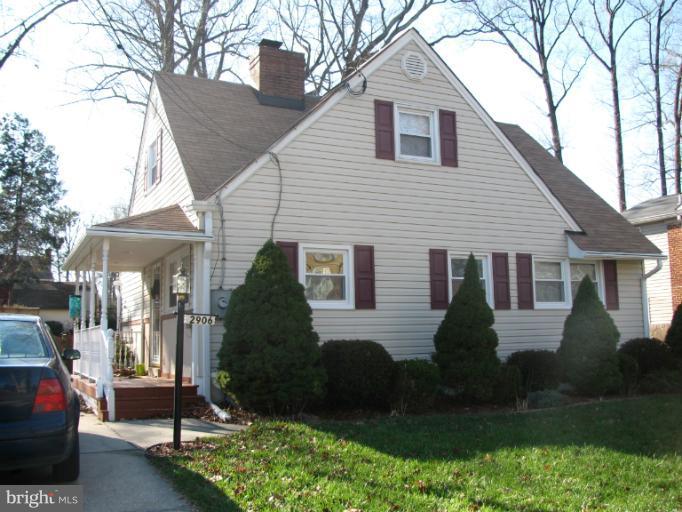2902 Blueridge Avenue Silver Spring, MD 20902 - Photo 3 of 8 a front view of a house with a yard and garage