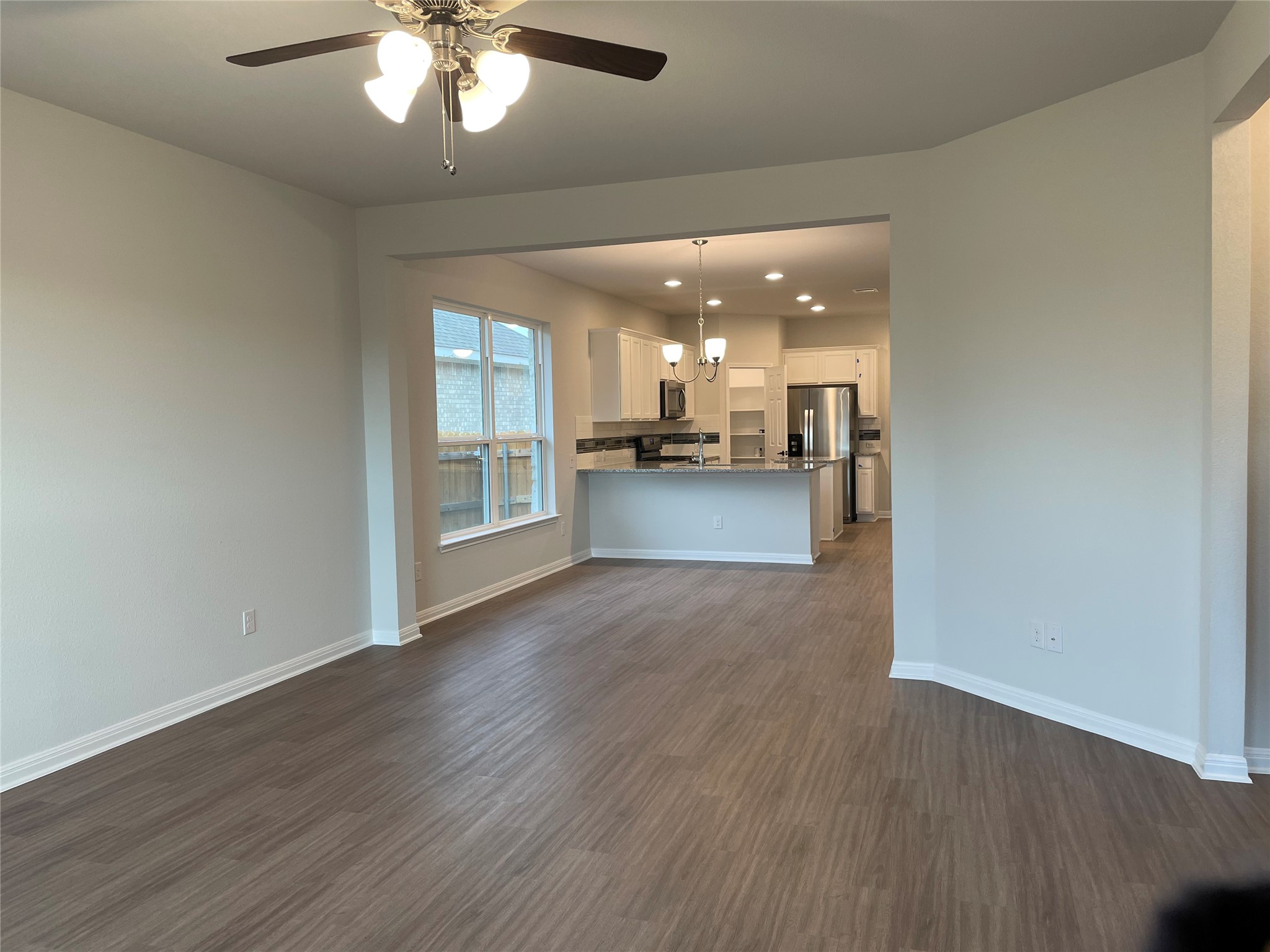 3908 Birdwatch Loop, Unit 56 Pflugerville, TX 78660 - Photo 15 of 30 a view of a livingroom with a kitchen