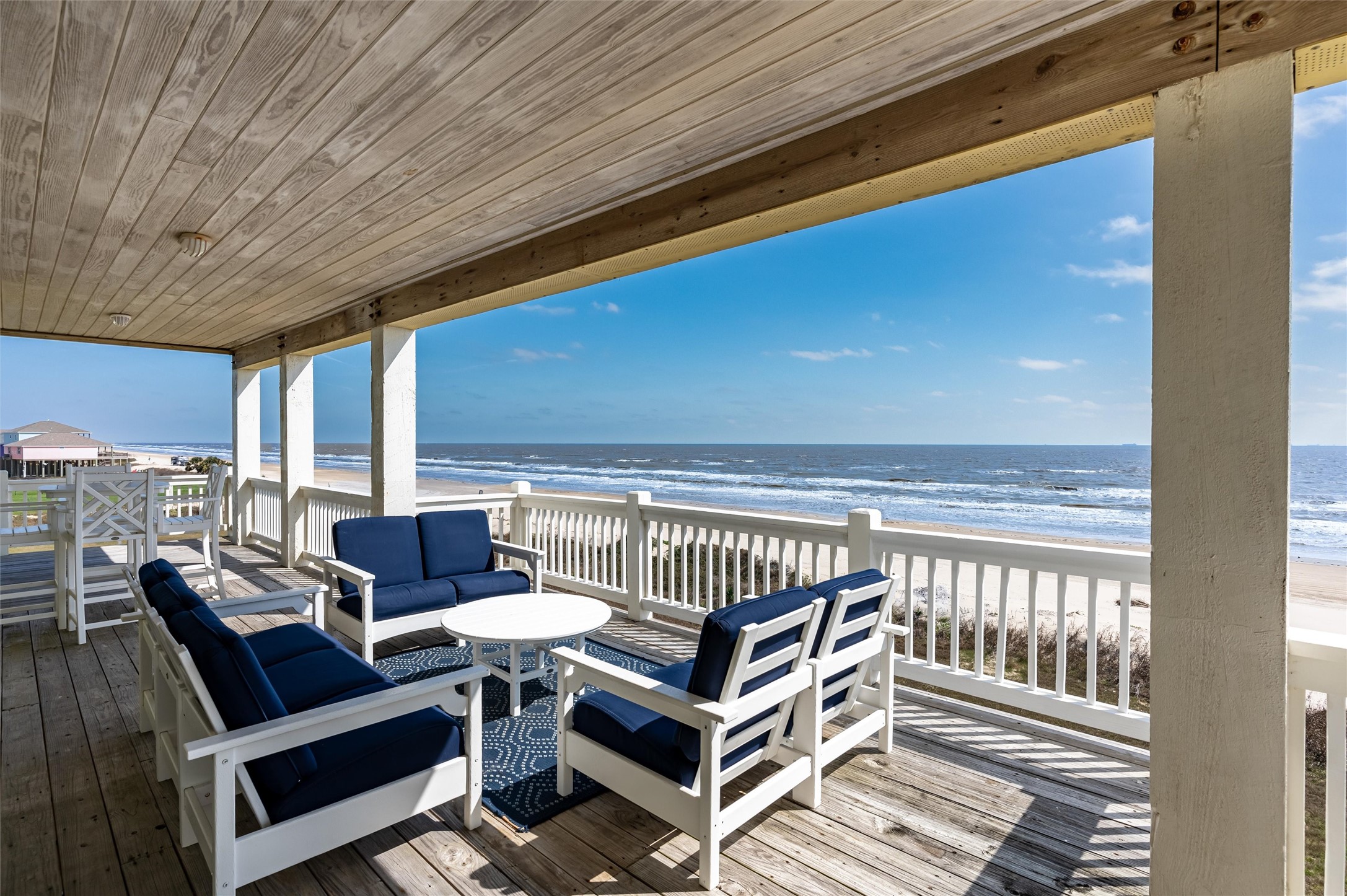 804 Eastview Crystal Beach, TX 77650 - Photo 26 of 50 a roof deck with a table and chairs
