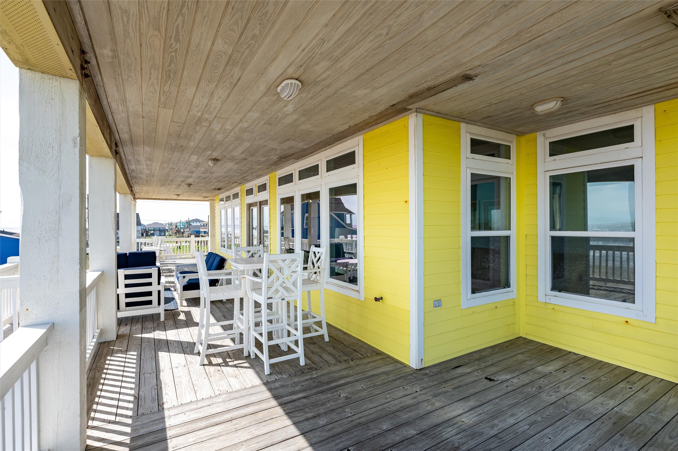 804 Eastview Crystal Beach, TX 77650 - Photo 28 of 50 a view of a patio with wooden floor and iron stairs