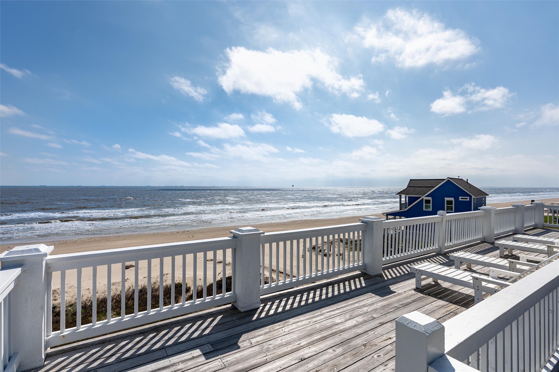 804 Eastview Crystal Beach, TX 77650 - Photo 31 of 50 a view of a roof deck with wooden floor and fence
