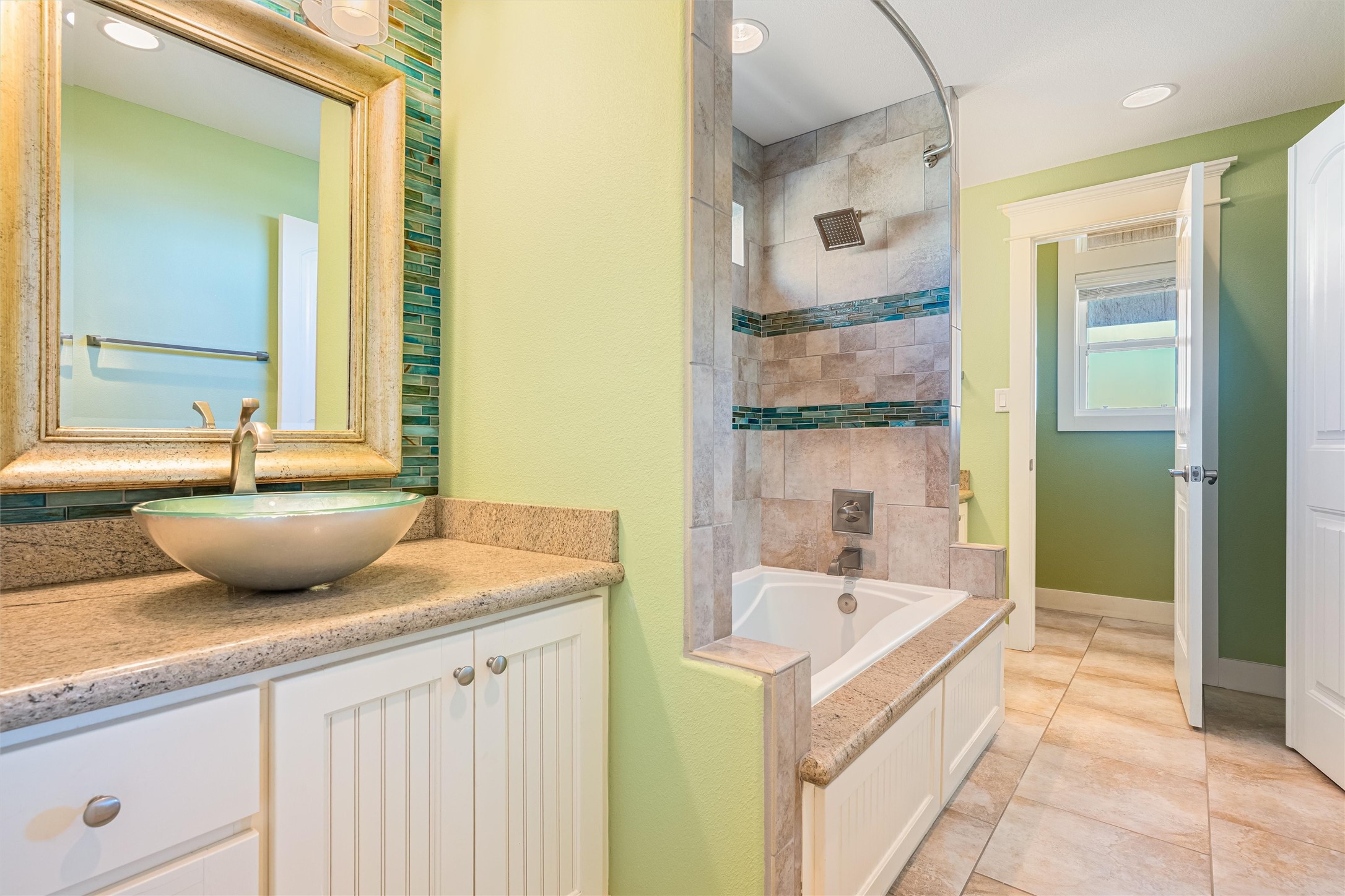 804 Eastview Crystal Beach, TX 77650 - Photo 36 of 50 a bathroom with a tub sink and mirror